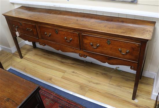 A George III oak dresser fitted three drawers W.194cm